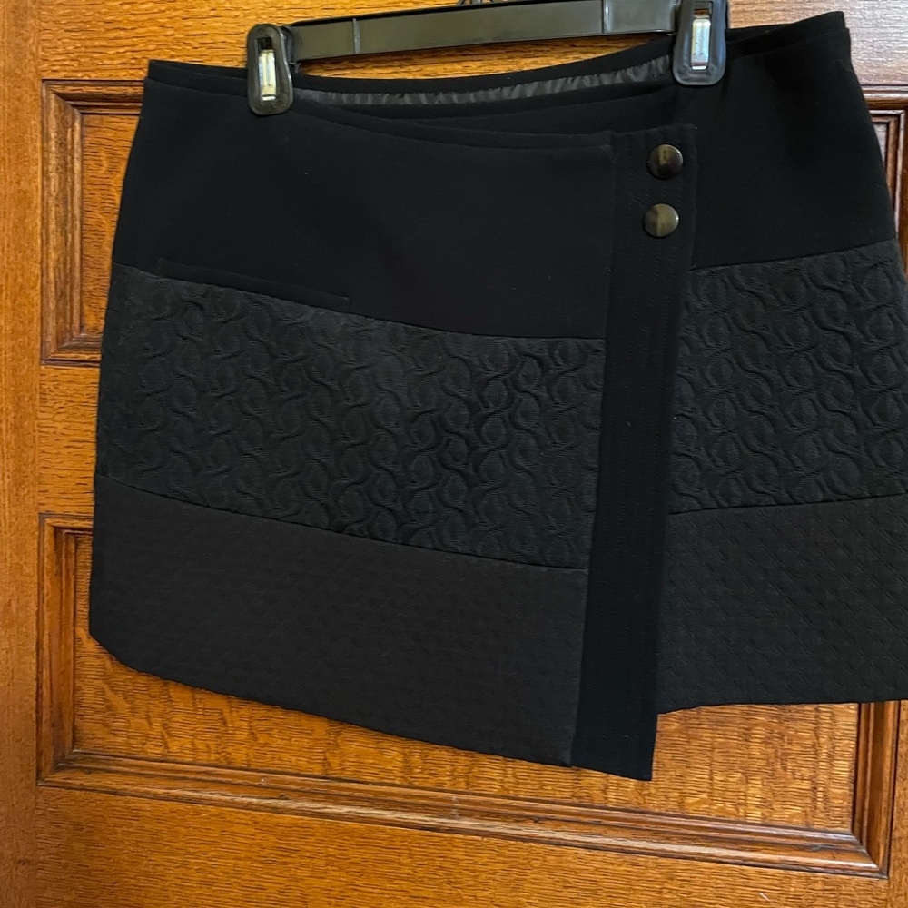 CAbi black lined wool short skirt to wear over leggings or tights.